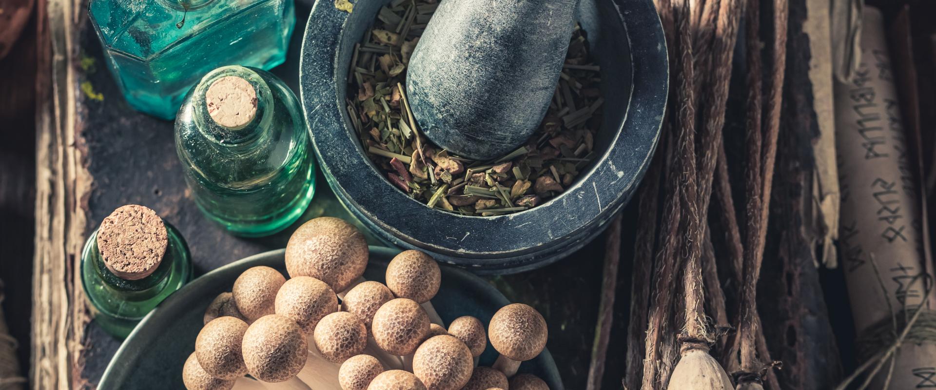 Herbs, bottles, pestle and mortar