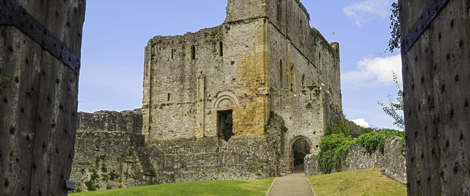 Looking through a doorway towards a tower in Chepstow Castle