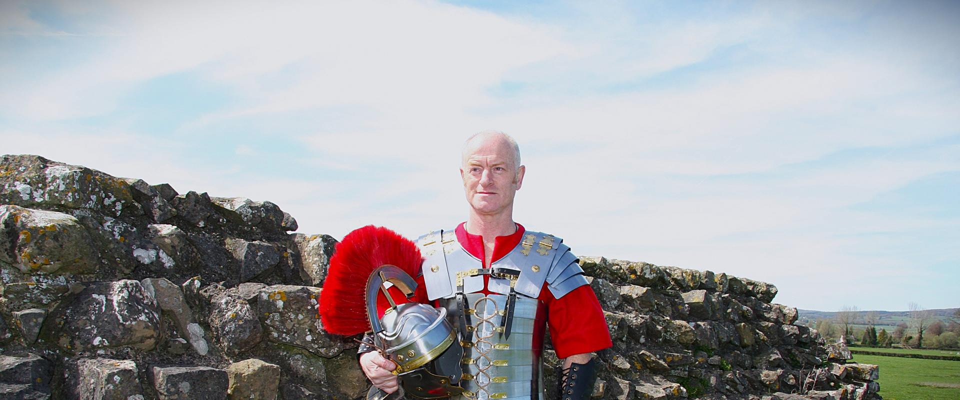 A Roman Centurion stood by a wall