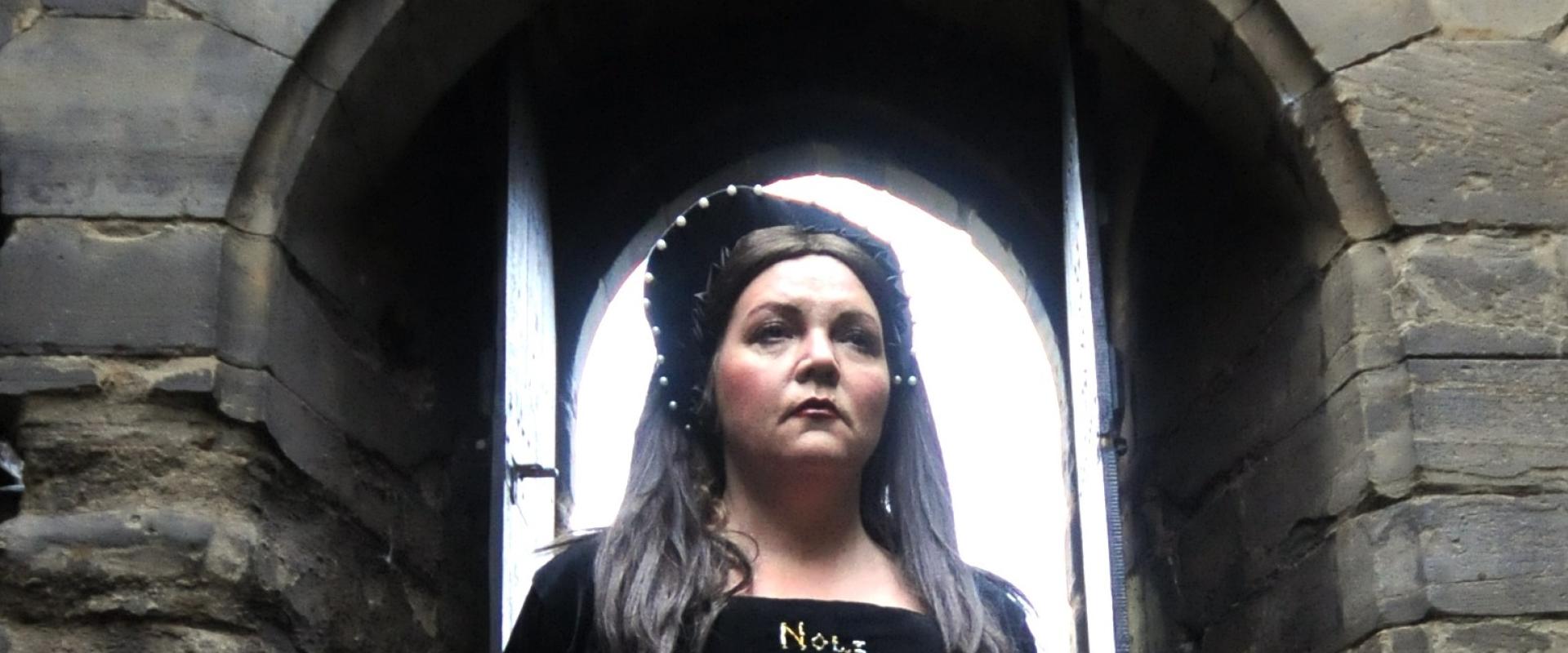 Historian in costume depicting Anne Boleyn