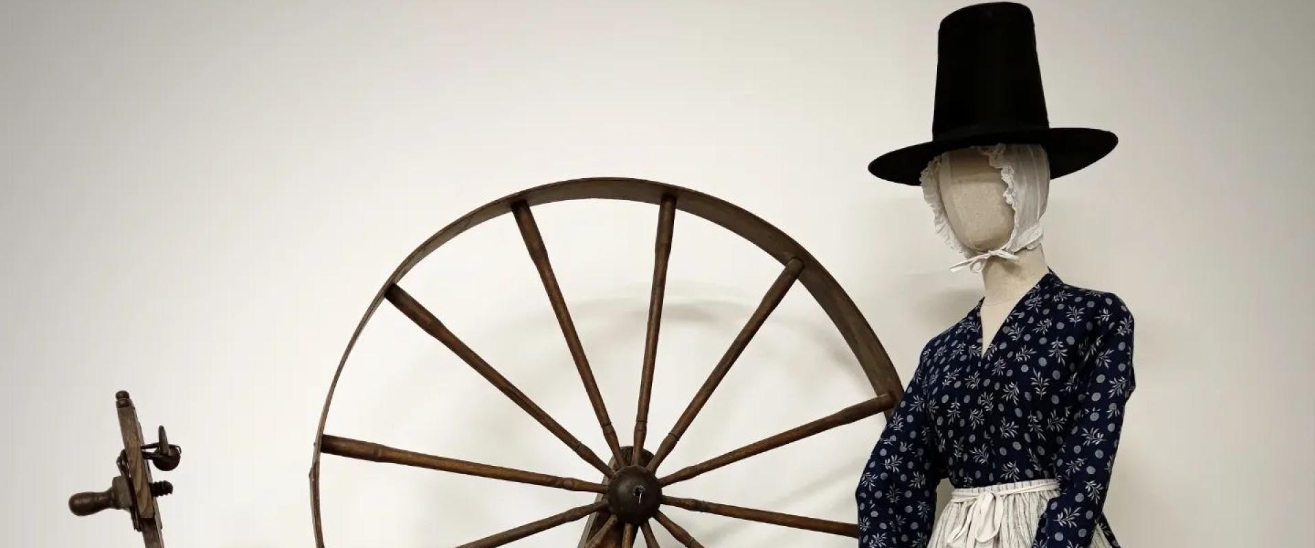 traditional spinning wheel and Welsh lady dress