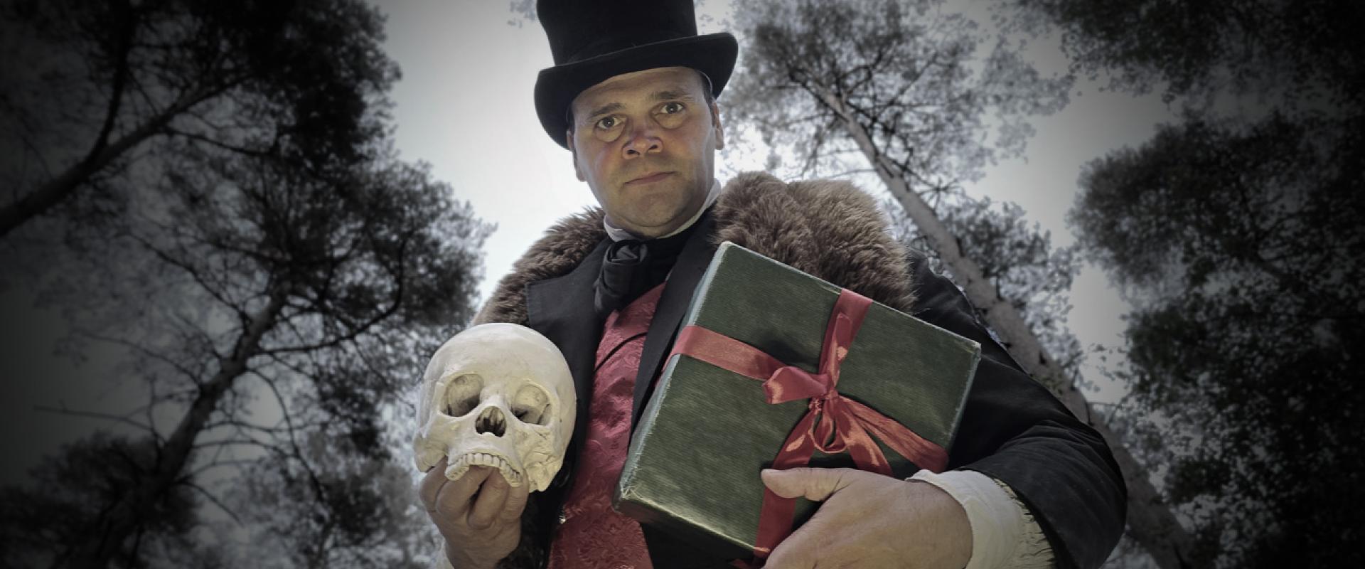 Spooky Edwardian gentleman holding a skull